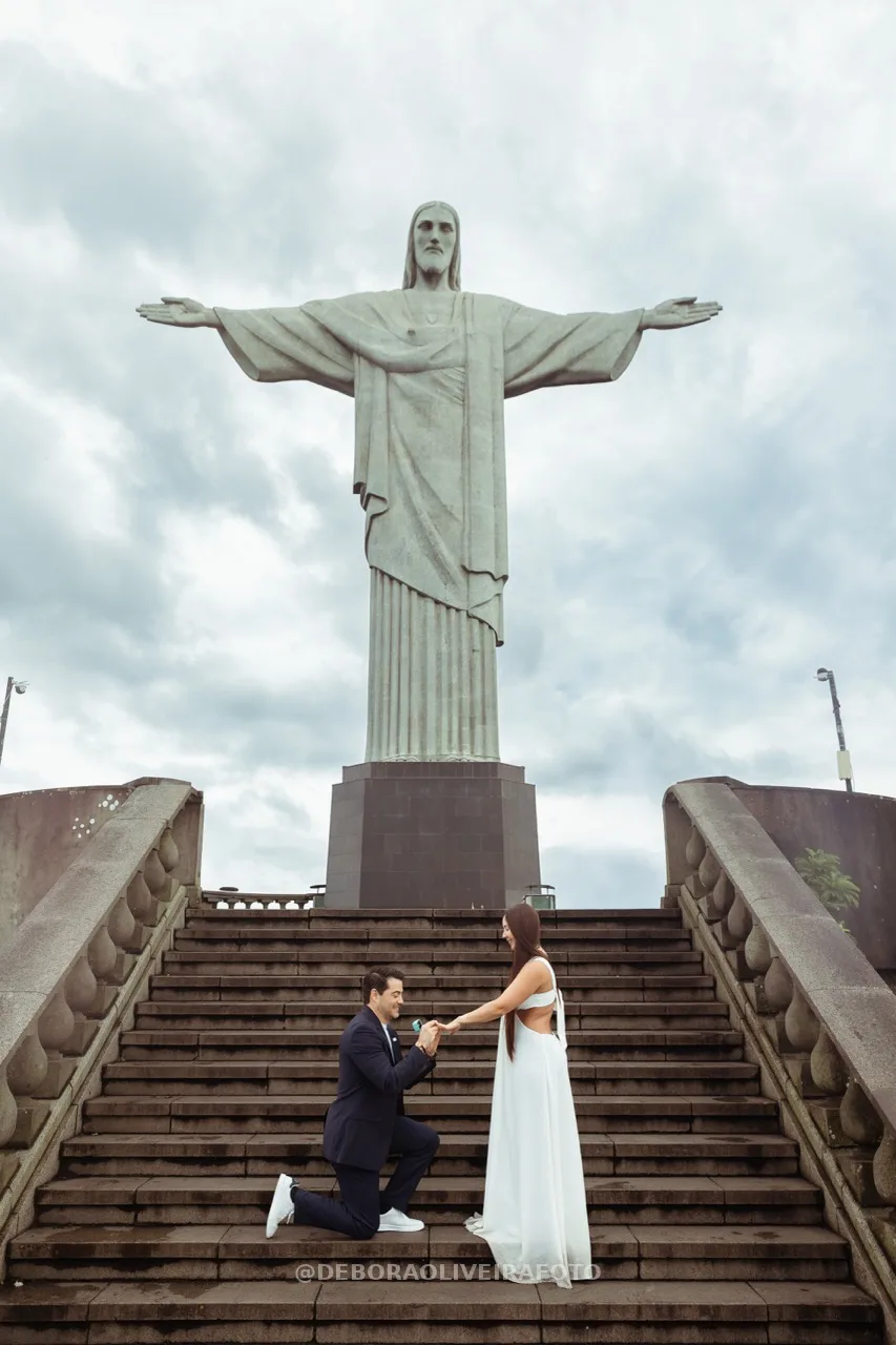 Proposal moment with Tiffany ring box on Cristo stairs – photo 16