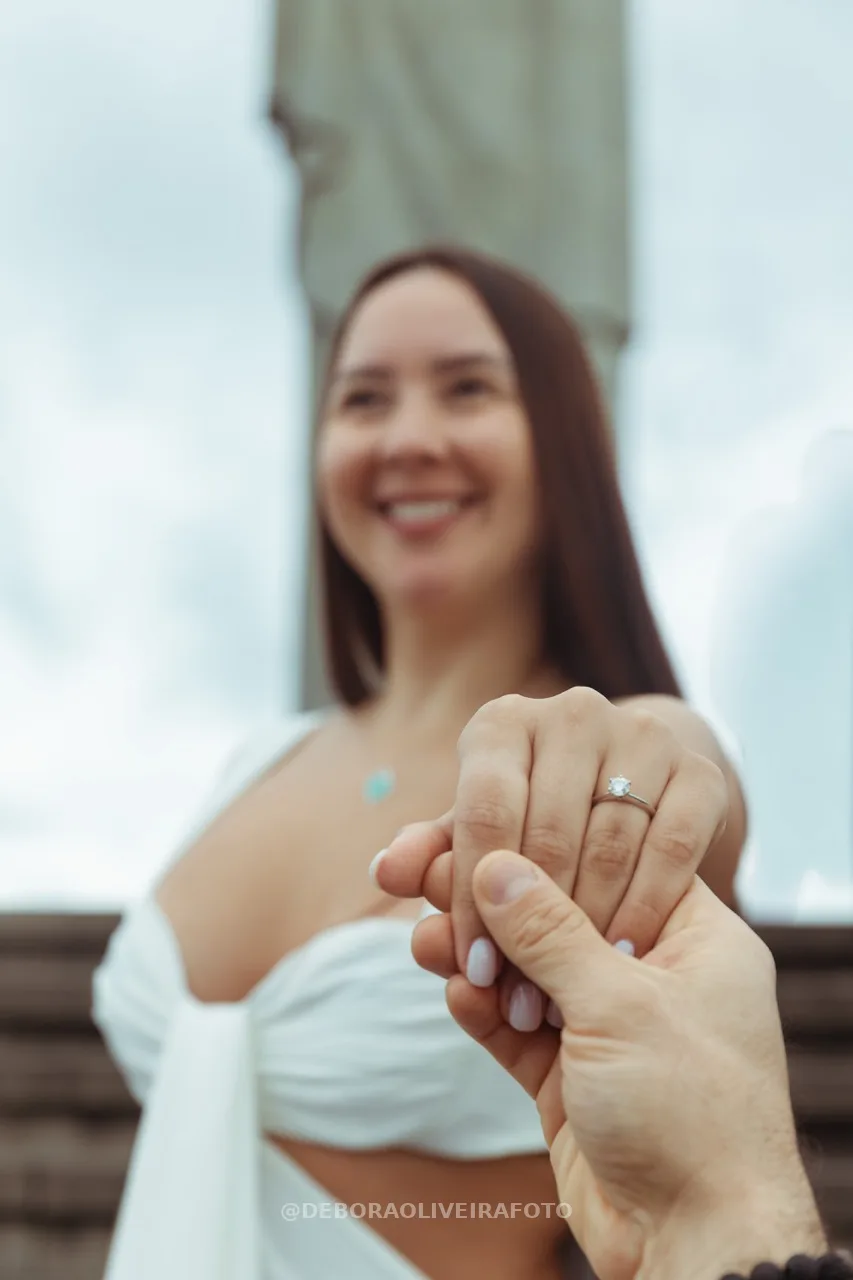 Alexandra smiling and showing her engagement ring – photo 24