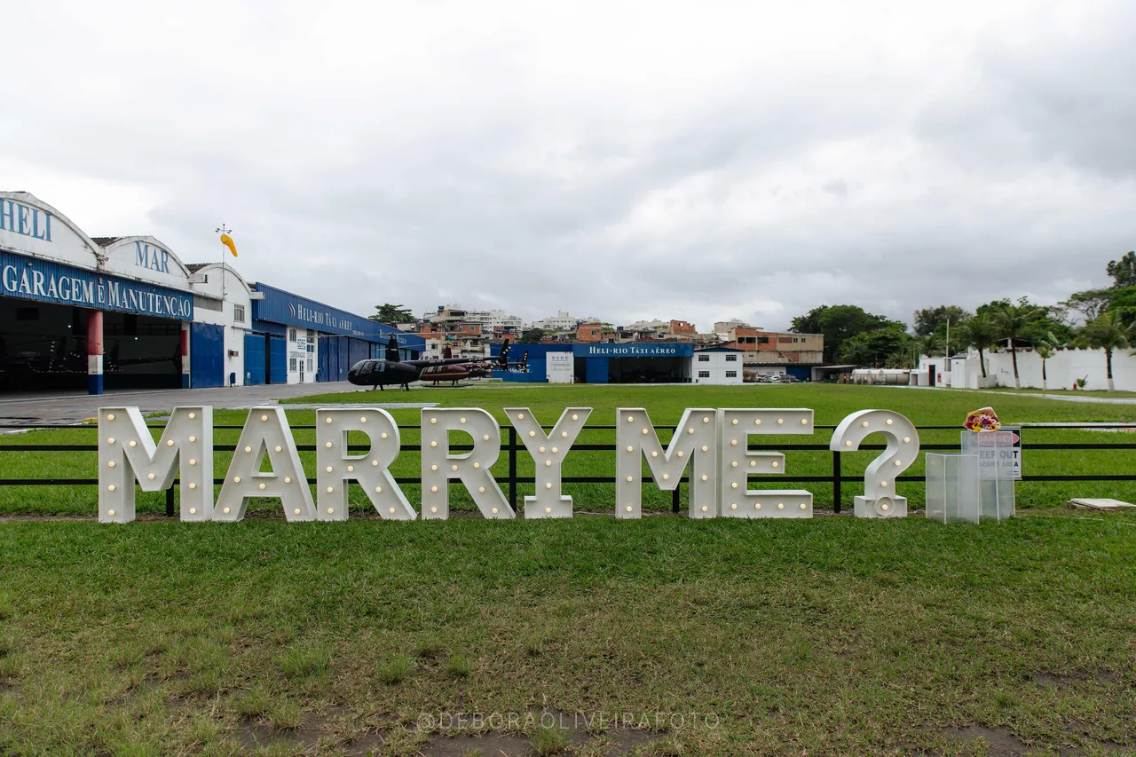 Lit Marry Me letters at a heliport in Rio de Janeiro for a marriage proposal