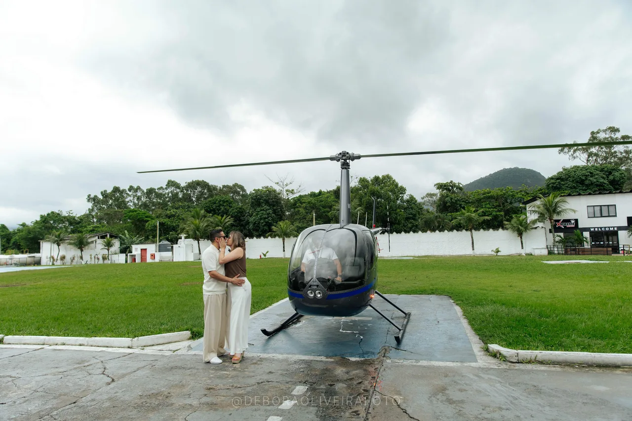 Engaged couple on the helipad after the helicopter flight