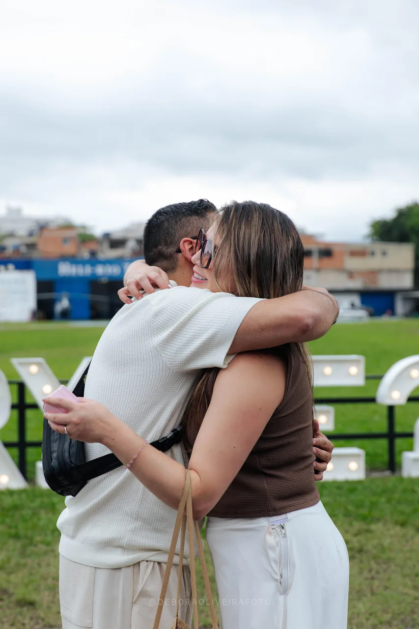 Couple hugging after a heliport marriage proposal in Rio de Janeiro