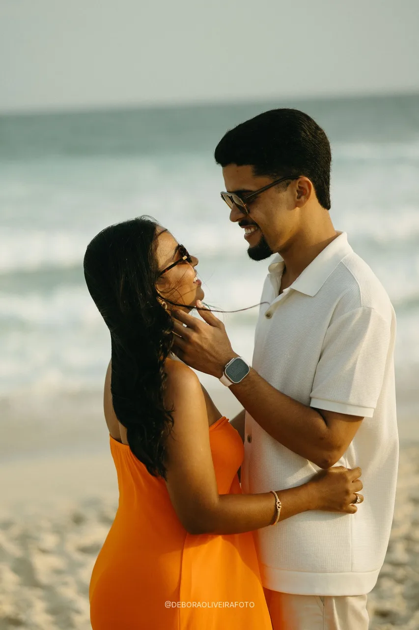 Samuel and Emile embracing on the beach